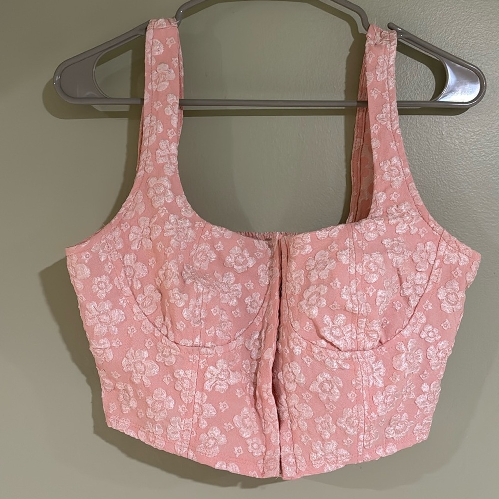 Pink cropped top.